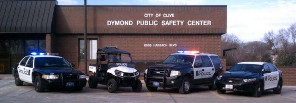 Clive police building with police vehicles parked in front