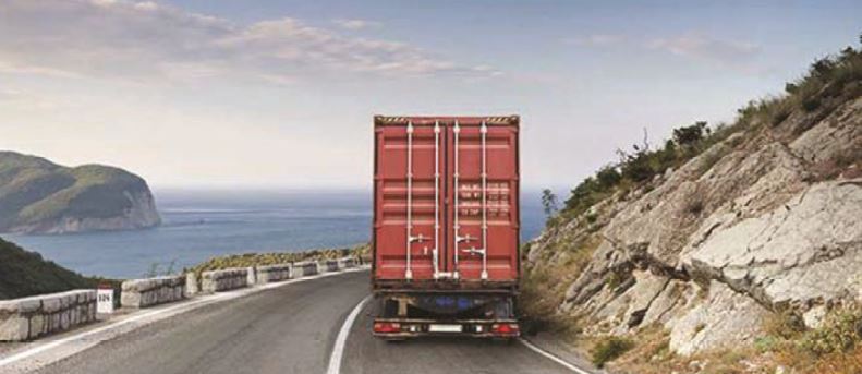 Express Logistics photo of the back of a semi truck driving on a two lane road