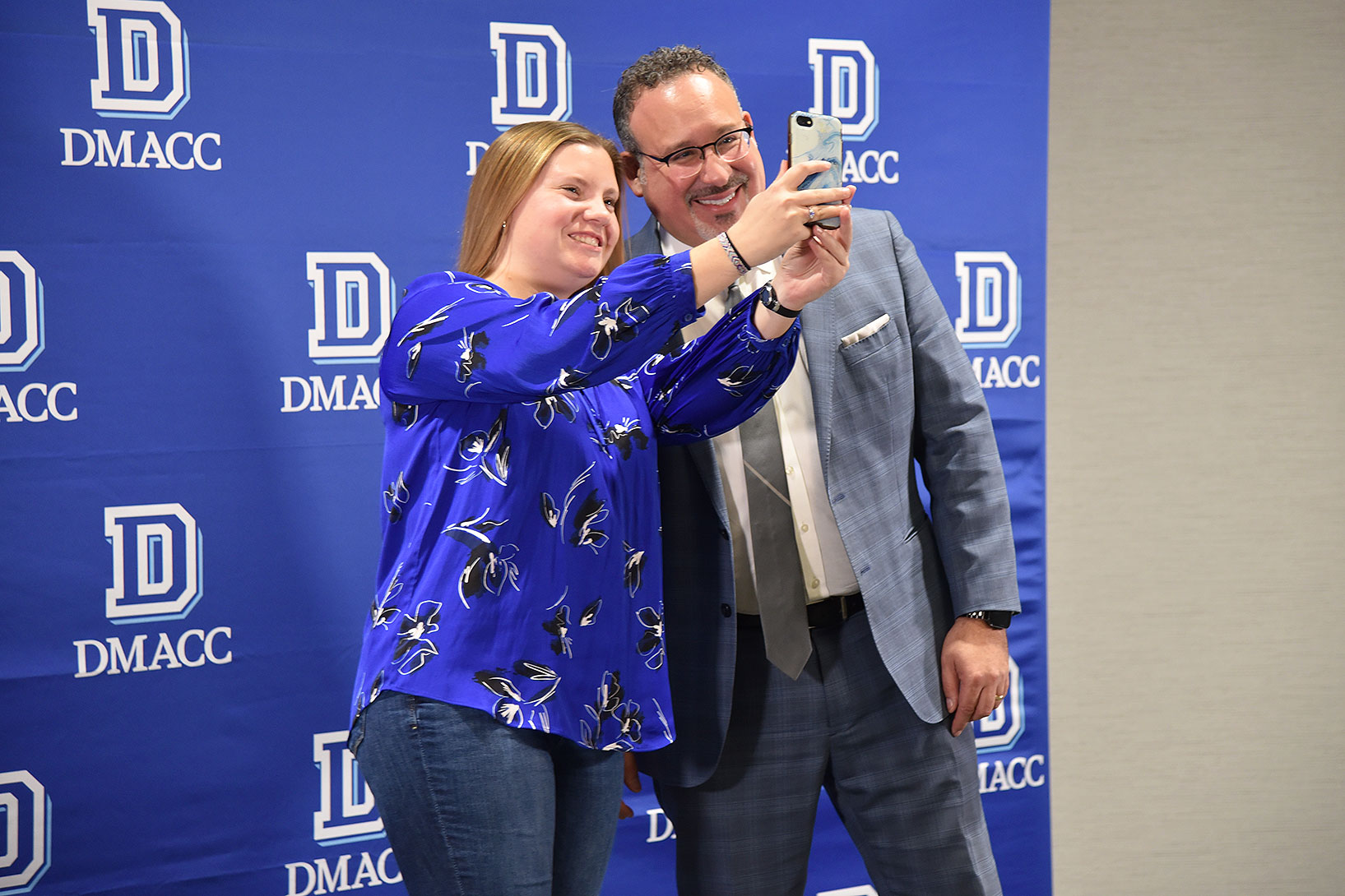 Second-year DMACC Education student Ariana Gray (left) of Urbandale takes a selfie with U.S. Secretary of Education Dr. Miguel Cardona​ on Dec. 7, 2023, at the DMACC Ankeny Campus. Gray, who is working toward an elementary education degree, participated in a student panel with Dr. Cardona during his visit to the College.   "The thing I'm most looking forward to as an educator is getting to experience the moments when a child connects with the information and understands what I'm trying to teach them," Gray said.